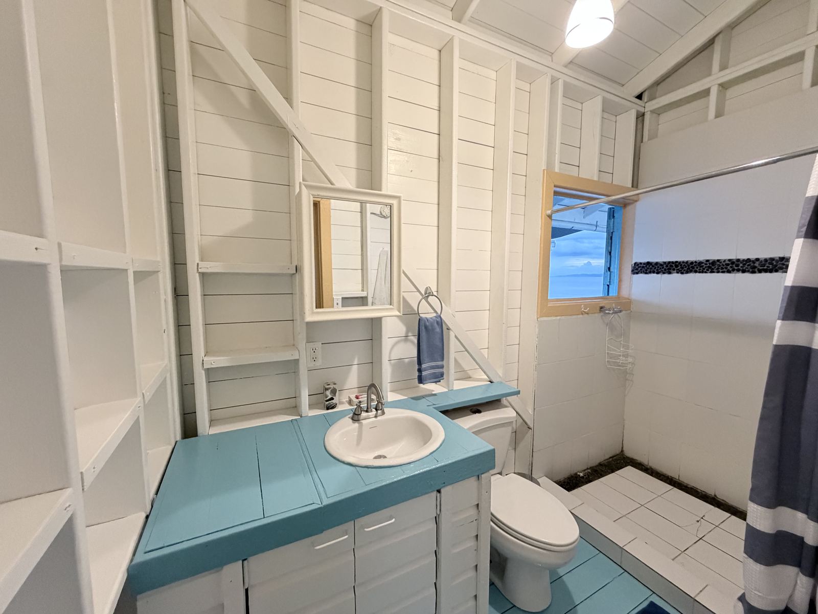 Bathroom at Casa Clearwater with a window to the sea